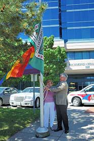 Mayor Dave Barrow and Barbara Urman raise the Rainbow Flag at Richmond Hill Civic Centre.
