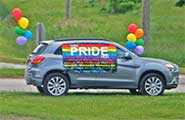 A decorated car welcomes guests arriving at the BBQ In The Village event.